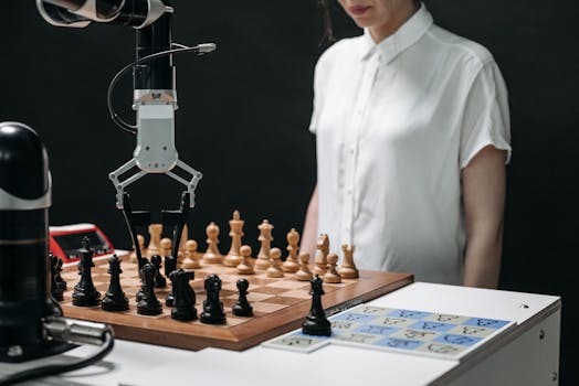 pexels-photo-8438954-8438954 A robotic arm and a person engaged in a strategic chess match on a chessboard.